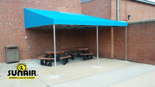 Canopy covering patio furniture